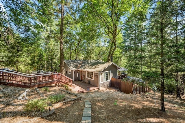 16635 Mountain View Dr, Cobb, CA 95426 - back of house with a wooden deck and a wooded view