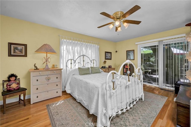 16635 Mountain View Dr, Cobb, CA 95426 - bedroom featuring access to outside, wood finished floors, and a ceiling fan