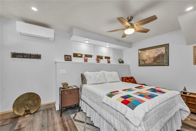 16635 Mountain View Dr, Cobb, CA 95426 - bedroom with a wall unit AC, wood finished floors, recessed lighting, and ceiling fan