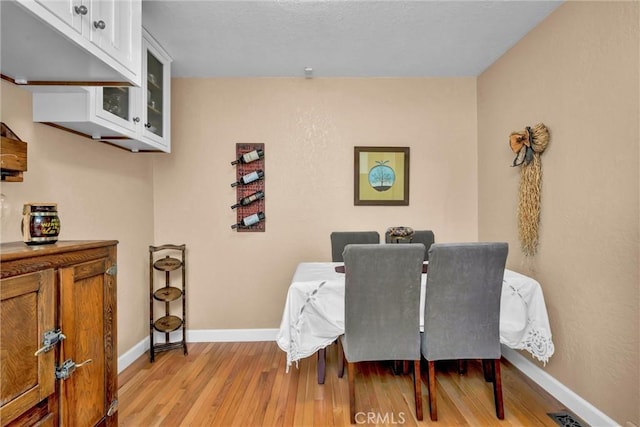 16635 Mountain View Dr, Cobb, CA 95426 - dining room featuring light wood-style flooring and baseboards