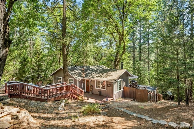 16635 Mountain View Dr, Cobb, CA 95426 - back of house with a deck, a view of trees, and roof with shingles