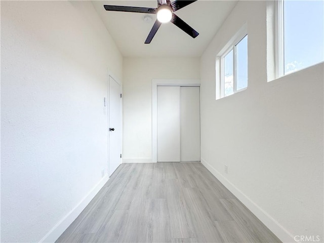 10408 Kalmia St, Los Angeles, CA 90002 - unfurnished bedroom featuring light wood finished floors, a closet, and ceiling fan
