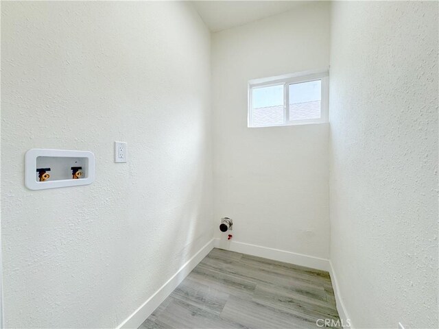 10408 Kalmia St, Los Angeles, CA 90002 - washroom featuring hookup for a washing machine, light wood-style floors, and hookup for a gas dryer