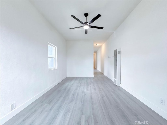 10408 Kalmia St, Los Angeles, CA 90002 - spare room with a heating unit, wood finished floors, and a ceiling fan