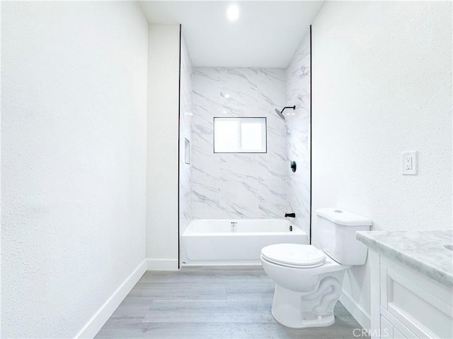 10408 Kalmia St, Los Angeles, CA 90002 - full bath featuring vanity, shower / tub combination, wood finished floors, and a textured wall
