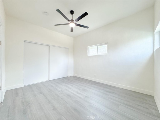 10408 Kalmia St, Los Angeles, CA 90002 - unfurnished bedroom featuring wood finished floors, a closet, and a ceiling fan