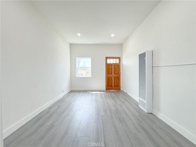 10408 Kalmia St, Los Angeles, CA 90002 - entrance foyer with a heating unit, wood finished floors, and recessed lighting