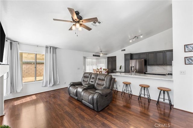 2019 Greentree St, Lancaster, CA 93535 - living area with ceiling fan, lofted ceiling, plenty of natural light, and dark wood finished floors