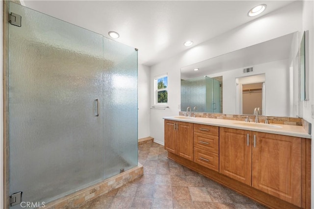39886 Worthington Pl, Temecula, CA 92591 - bathroom with a shower stall, double vanity, and recessed lighting