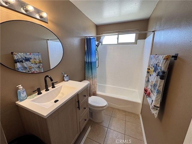 811 Mescal Dr, Barstow, CA 92311 - bathroom featuring shower / bath combo with shower curtain, vanity, tile patterned floors, and a textured wall