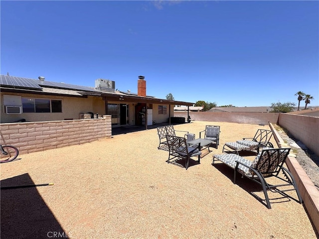 811 Mescal Dr, Barstow, CA 92311 - fenced backyard featuring a patio and an outdoor living space