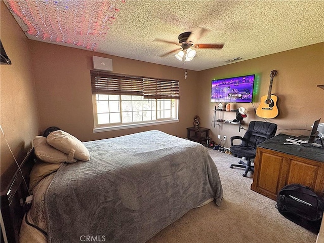 811 Mescal Dr, Barstow, CA 92311 - carpeted bedroom featuring a ceiling fan and a textured ceiling