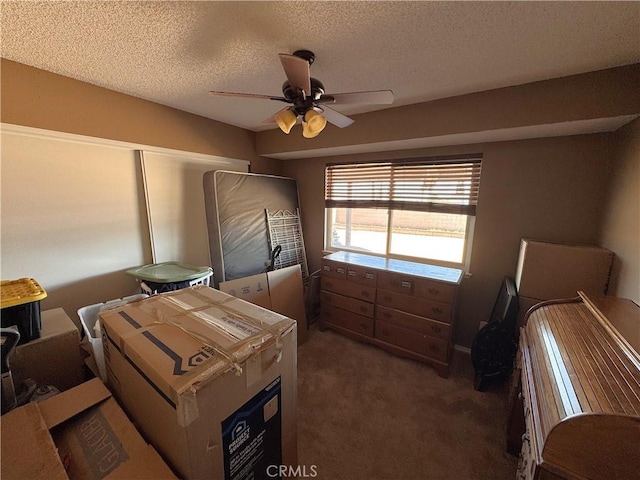 811 Mescal Dr, Barstow, CA 92311 - carpeted bedroom with a textured ceiling and a ceiling fan