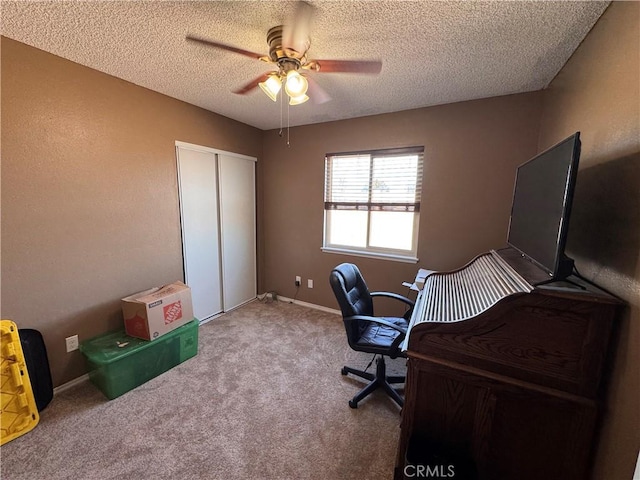 811 Mescal Dr, Barstow, CA 92311 - carpeted office featuring a textured ceiling and a ceiling fan