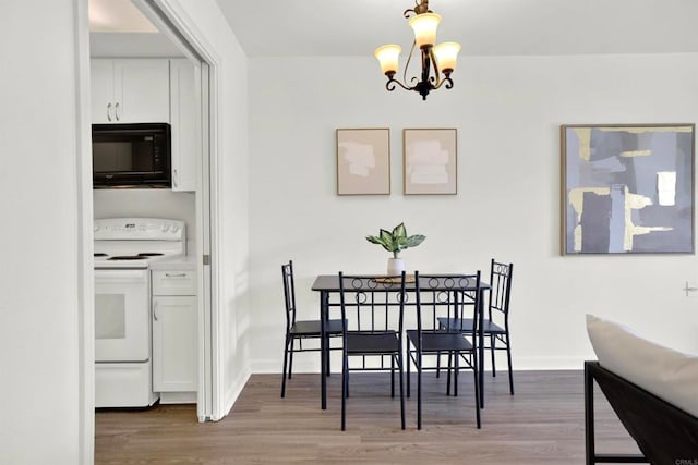 1508 Circa Del Lago Unit B205, San Marcos, CA 92078 - dining space with wood finished floors and a chandelier