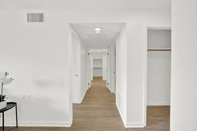 1508 Circa Del Lago Unit B205, San Marcos, CA 92078 - corridor with wood finished floors and attic access