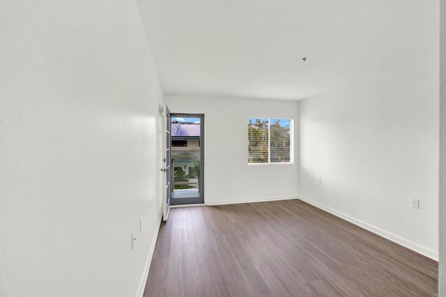 1508 Circa Del Lago Unit B205, San Marcos, CA 92078 - empty room with dark wood-style floors and baseboards