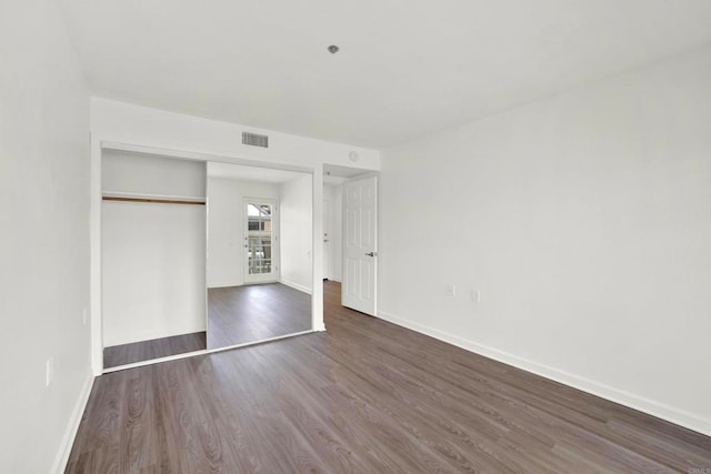 1508 Circa Del Lago Unit B205, San Marcos, CA 92078 - unfurnished bedroom featuring wood finished floors and a closet