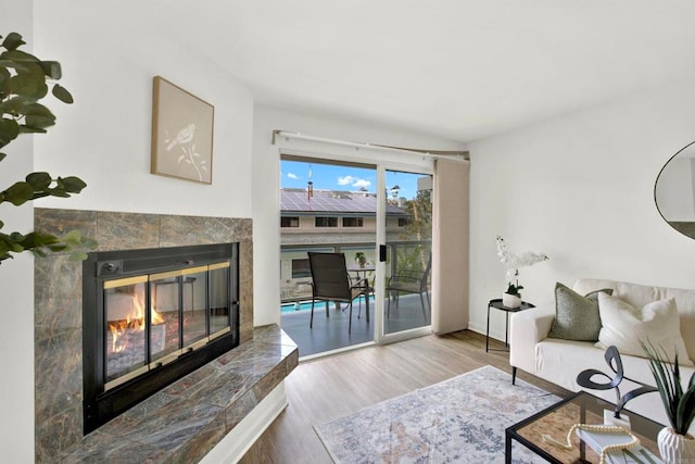 1508 Circa Del Lago Unit B205, San Marcos, CA 92078 - living area with wood finished floors and a fireplace