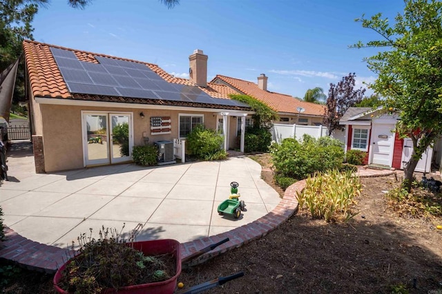 39668 Roripaugh Rd, Temecula, CA 92591 - rear view of property with a tile roof, stucco siding, a chimney, solar panels, and a patio