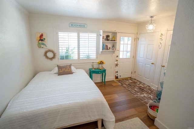 39668 Roripaugh Rd, Temecula, CA 92591 - bedroom with a chandelier, wood finished floors, and crown molding