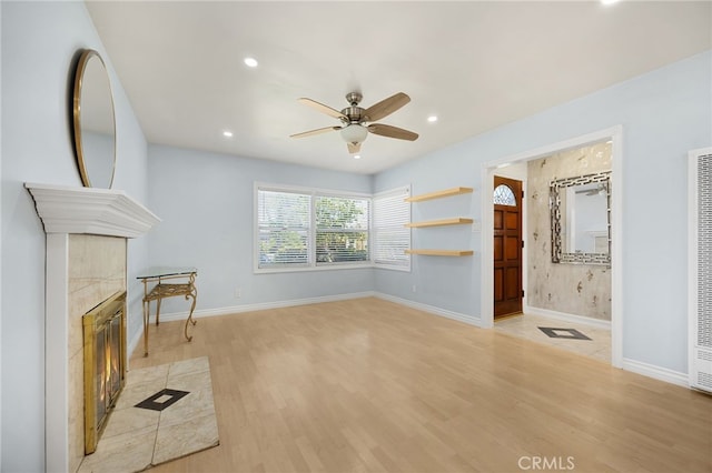 8328 Fernadel Ave, Pico Rivera, CA 90660 - unfurnished living room featuring a ceiling fan, light wood-style flooring, recessed lighting, and a fireplace