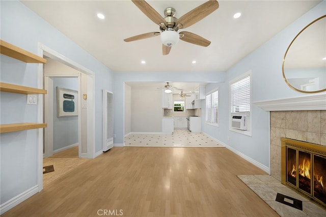 8328 Fernadel Ave, Pico Rivera, CA 90660 - unfurnished living room featuring a heating unit, a tile fireplace, ceiling fan, light wood-type flooring, and recessed lighting