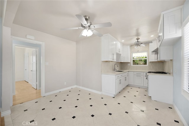 8328 Fernadel Ave, Pico Rivera, CA 90660 - kitchen featuring a ceiling fan, stove, decorative backsplash, recessed lighting, and light countertops