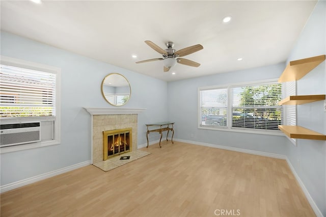8328 Fernadel Ave, Pico Rivera, CA 90660 - living area with a fireplace, ceiling fan, light wood-style floors, cooling unit, and recessed lighting