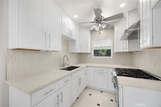 8328 Fernadel Ave, Pico Rivera, CA 90660 - kitchen featuring a ceiling fan, white cabinets, tasteful backsplash, light stone countertops, and recessed lighting