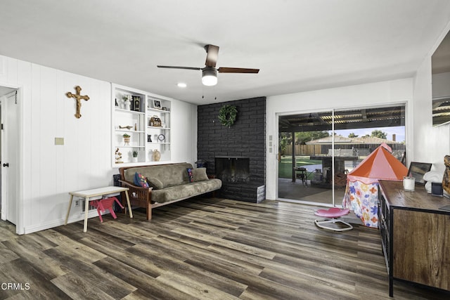 6100 Carter Ave, Bakersfield, CA 93308 - living area with ceiling fan, wood finished floors, and a fireplace