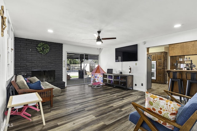 6100 Carter Ave, Bakersfield, CA 93308 - living room with a ceiling fan, wood finished floors, recessed lighting, and a fireplace