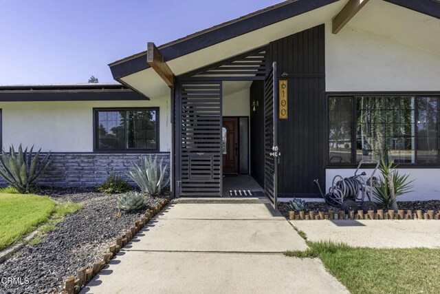 6100 Carter Ave, Bakersfield, CA 93308 - entrance to property with stone siding, stucco siding, and covered porch