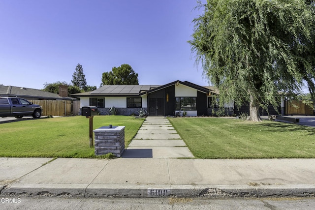 6100 Carter Ave, Bakersfield, CA 93308 - mid-century inspired home featuring roof mounted solar panels and stucco siding
