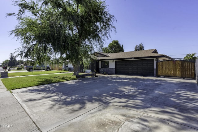 6100 Carter Ave, Bakersfield, CA 93308 - view of front of house with a garage and concrete driveway