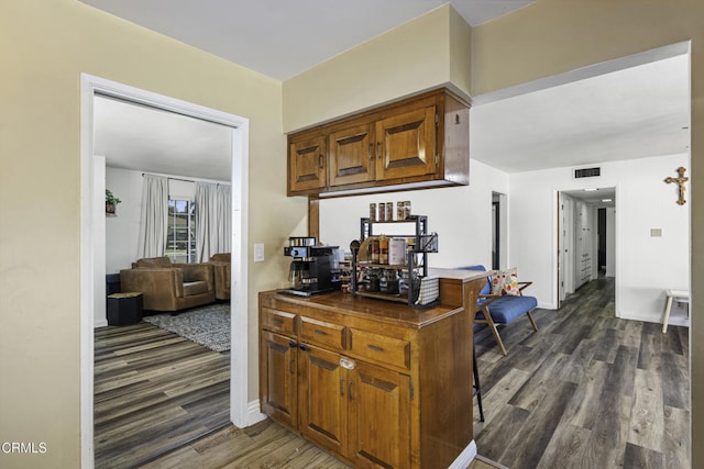 6100 Carter Ave, Bakersfield, CA 93308 - kitchen with dark wood-type flooring and brown cabinets