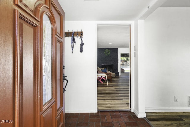 6100 Carter Ave, Bakersfield, CA 93308 - entrance foyer with a fireplace and brick patterned flooring