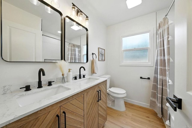 640 Pyramid St, San Diego, CA 92114 - bathroom featuring wood finished floors and double vanity