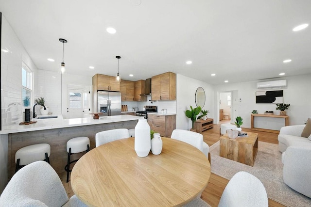 640 Pyramid St, San Diego, CA 92114 - dining area with a wall unit AC, light wood-style flooring, and recessed lighting