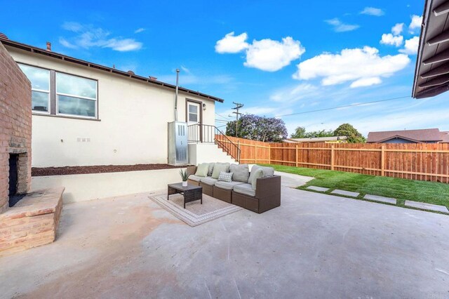 640 Pyramid St, San Diego, CA 92114 - fenced backyard with an outdoor hangout area and a patio area