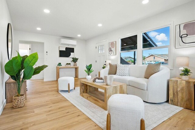 640 Pyramid St, San Diego, CA 92114 - living room featuring a wall mounted air conditioner, recessed lighting, and light wood finished floors