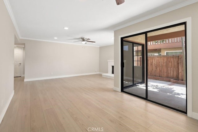 2639 Cameron Unit 119, Anaheim, CA 92801 - spare room with a ceiling fan, ornamental molding, light wood-style flooring, recessed lighting, and a brick fireplace