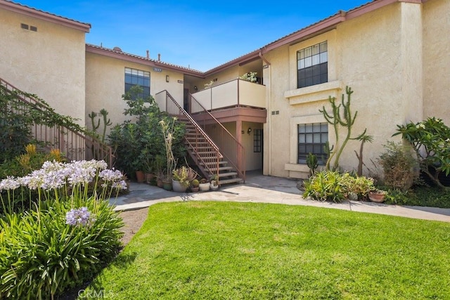 2639 Cameron Unit 119, Anaheim, CA 92801 - back of property featuring stucco siding and stairs