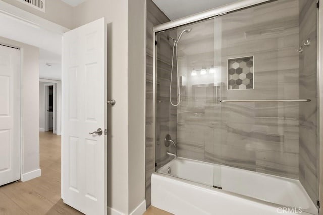 2639 Cameron Unit 119, Anaheim, CA 92801 - full bath featuring bath / shower combo with glass door and wood finished floors