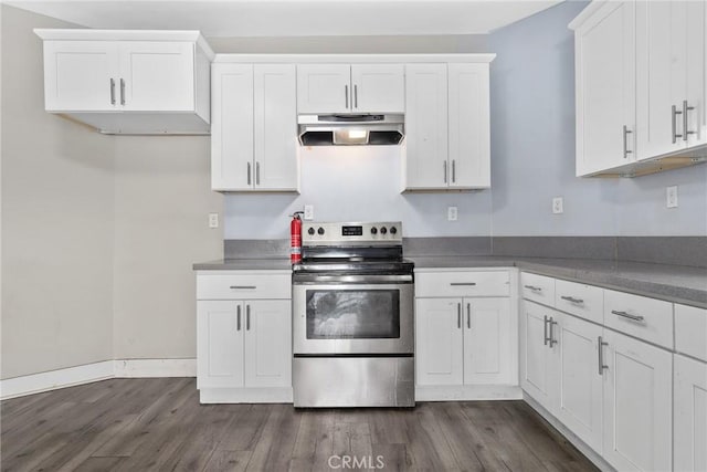3561 E 6th St, Los Angeles, CA 90023 - kitchen with stainless steel range with electric cooktop, ventilation hood, dark wood-type flooring, white cabinets, and dark countertops