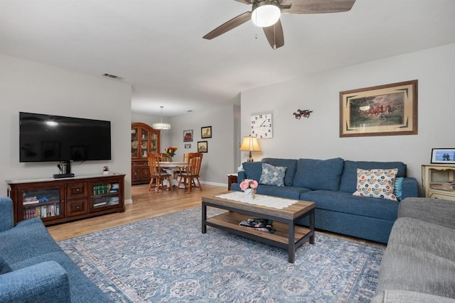4396 Albatross Way, Oceanside, CA 92057 - living area featuring wood finished floors and a ceiling fan