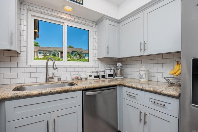 4396 Albatross Way, Oceanside, CA 92057 - kitchen featuring stainless steel appliances, backsplash, and light stone counters