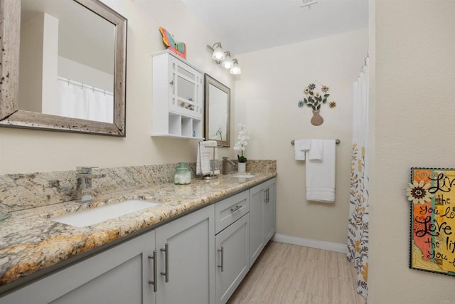 4396 Albatross Way, Oceanside, CA 92057 - bathroom featuring double vanity and baseboards