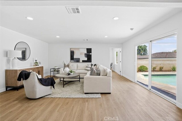 413 N Rimhurst Ave, Covina, CA 91724 - living room with light wood-style floors and recessed lighting