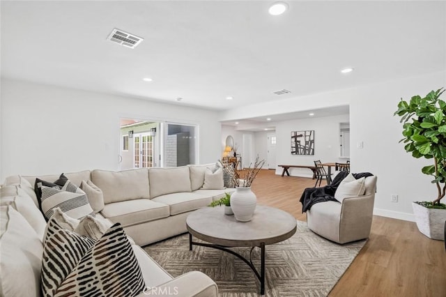 413 N Rimhurst Ave, Covina, CA 91724 - living area featuring light wood-style floors and recessed lighting